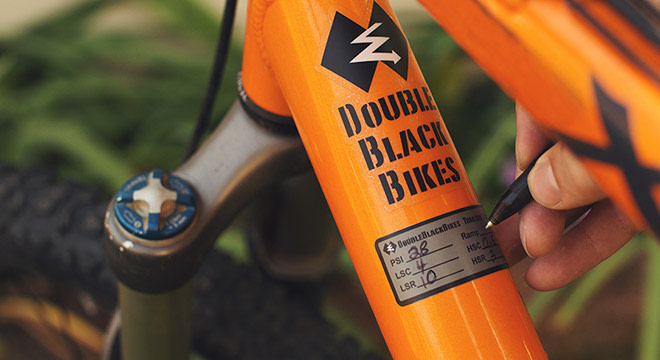 Custom bike sticker on orange bike
