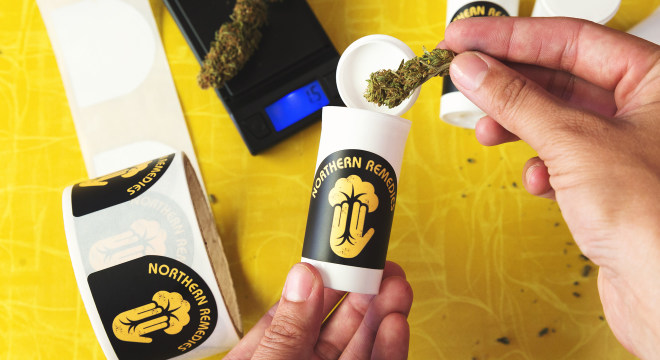 Customized cannabis labels on a plastic jar