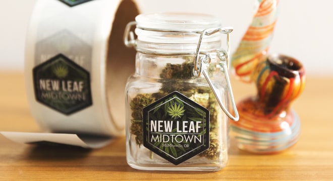 Customized cannabis labels on a glass jar