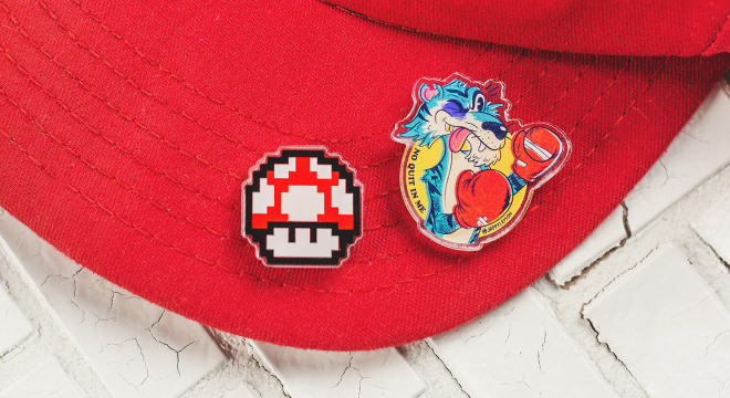 Custom hat pins of a cartoons on a red cap brim