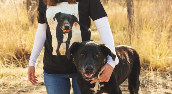 Owner wearing a custom t-shirt of a photo of the dog