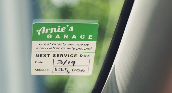 Custom service reminder sticker applied to windshield