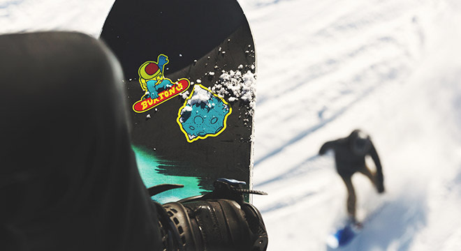 Snowboard stickers applied to board