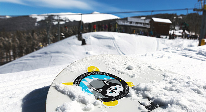 Snowboard stickers on mountain