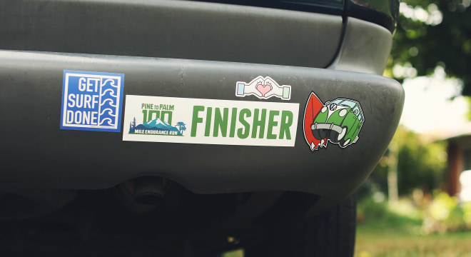 Custom bumper stickers on car bumper