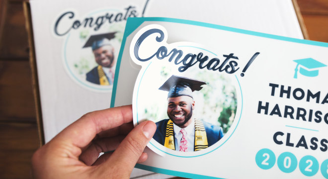 giving out custom kiss cut stickers for a fun graduation giveaway