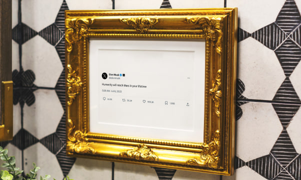 Framed post in gold frame on shelf