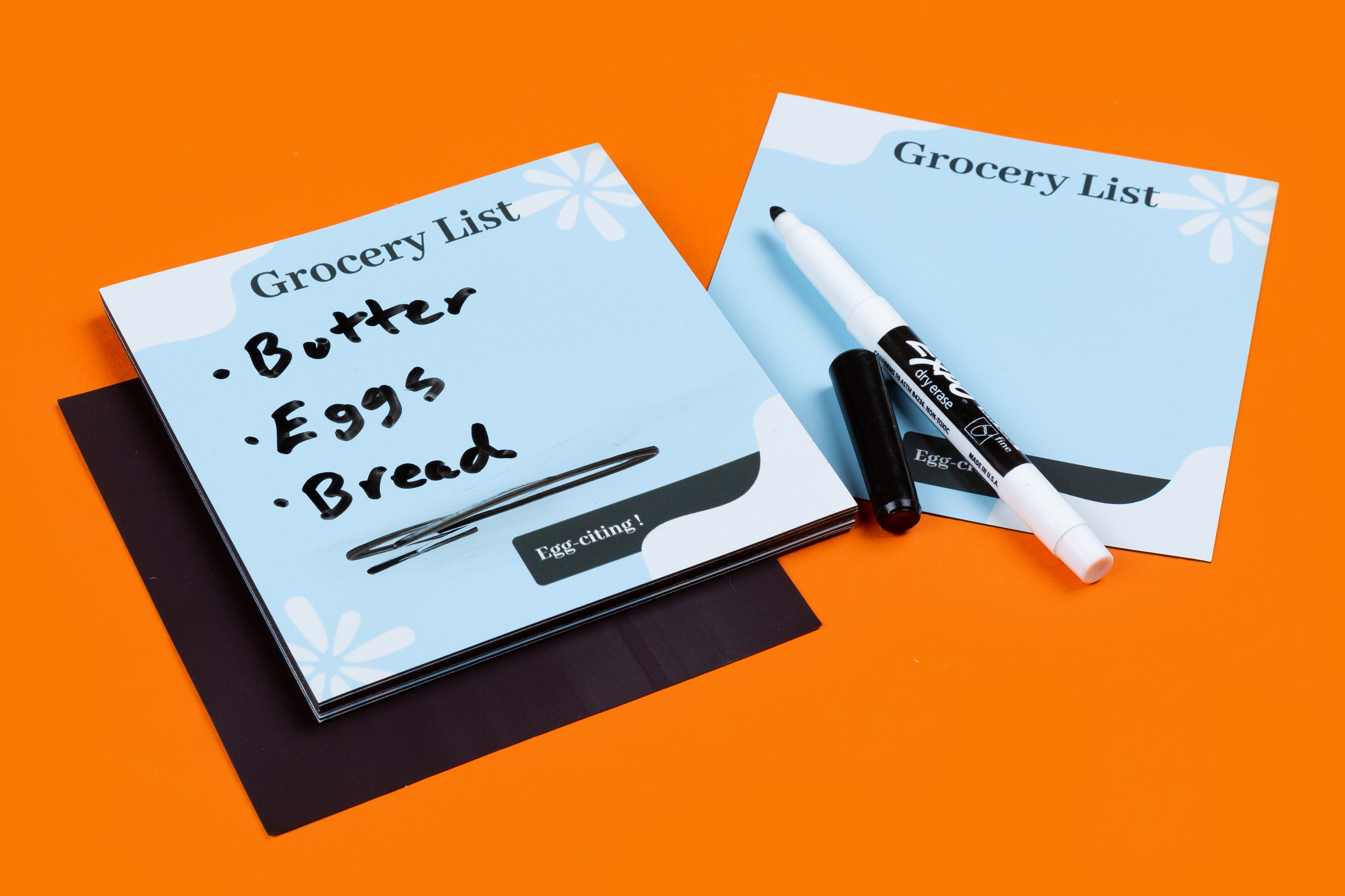 grocery list written on a custom magnet with dry erase marker