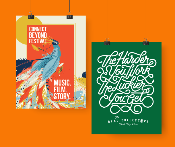 custom printed posters hanging on an orange background