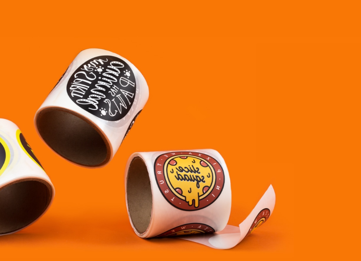 image of three roll labels on an orange background
