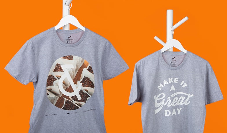 two grey custom t-shirts on an orange background