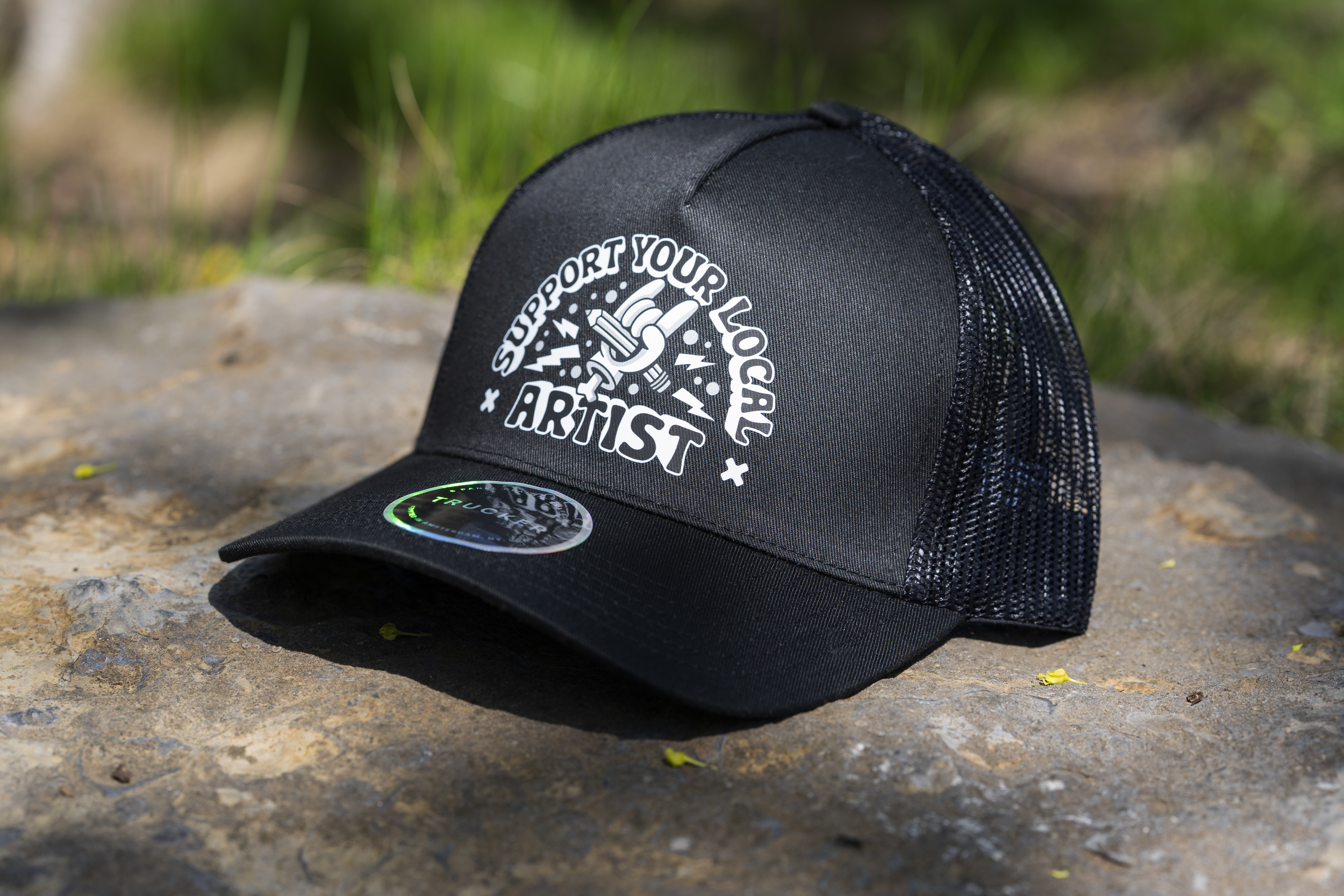 black custom trucker hat with a white logo on the front panel