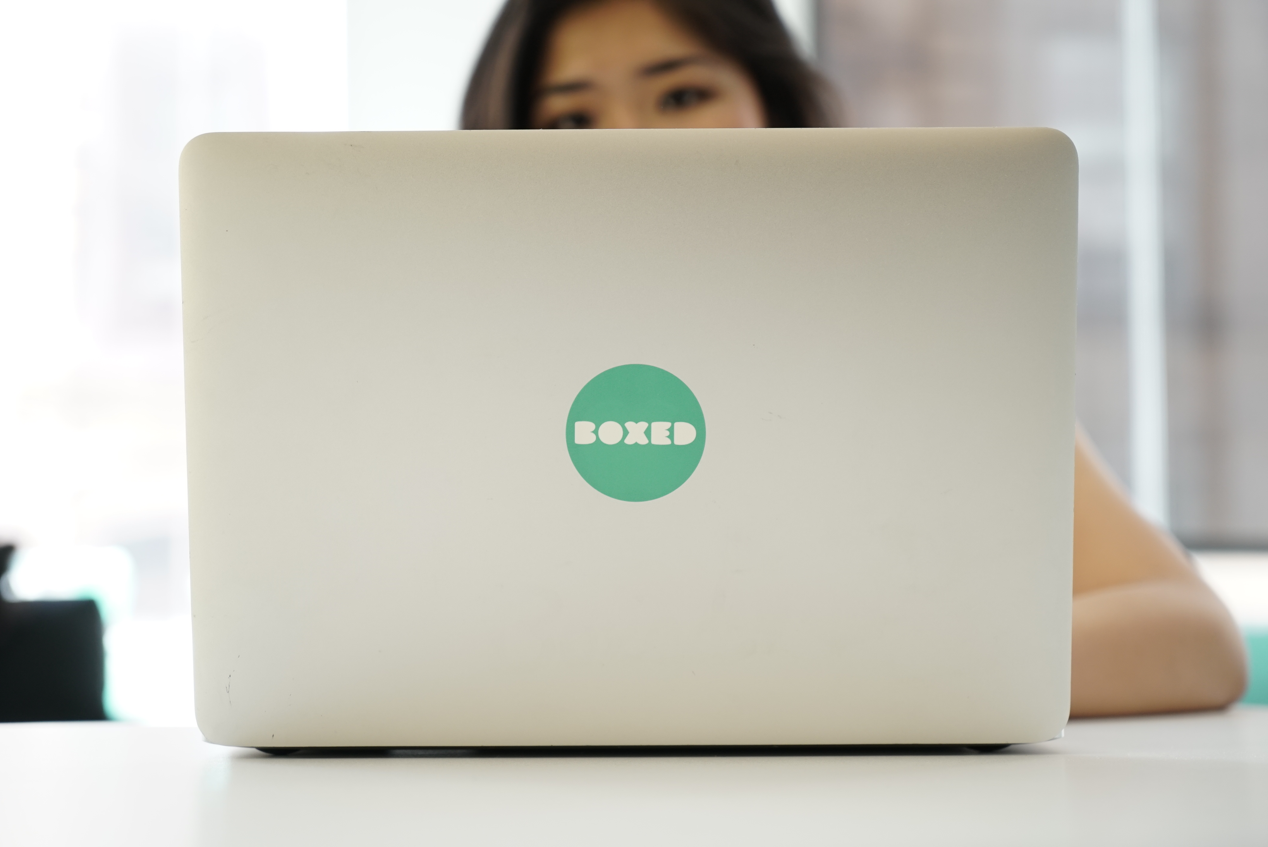 Custom company logo stickers on laptop
